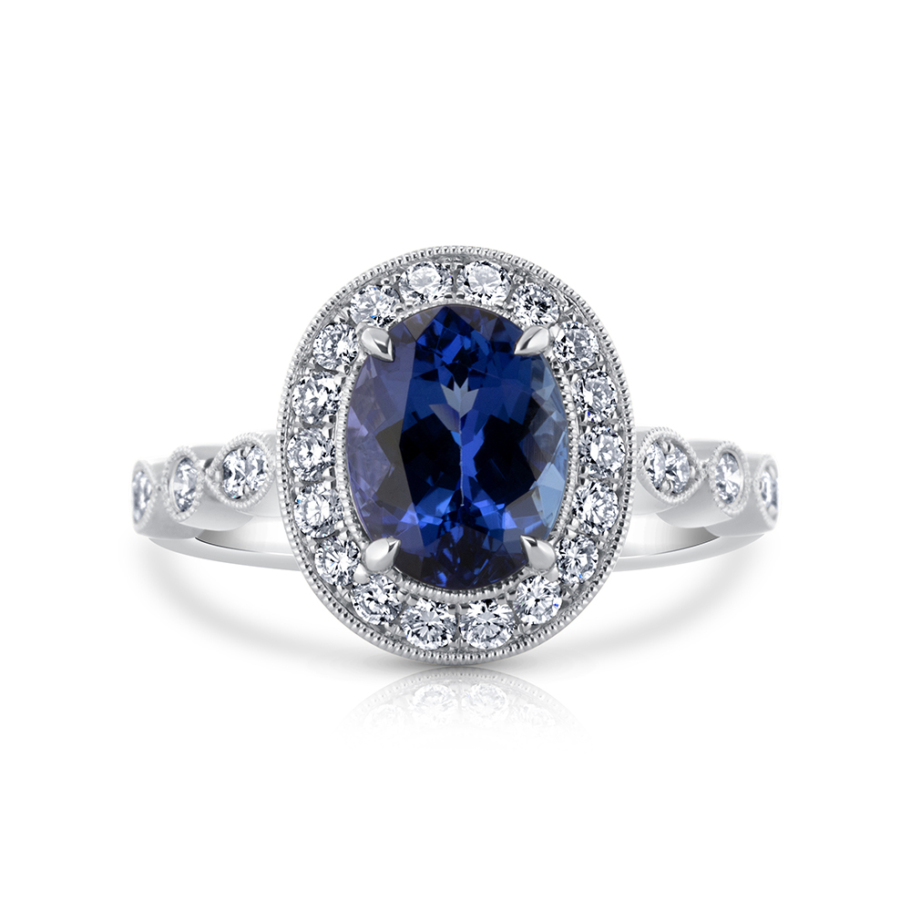 View Oval Tanzanite And Fancy Diamond Halo Ring